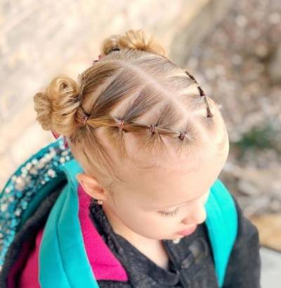 Center Parted Hairstyle With Angled Layers And Pigtails